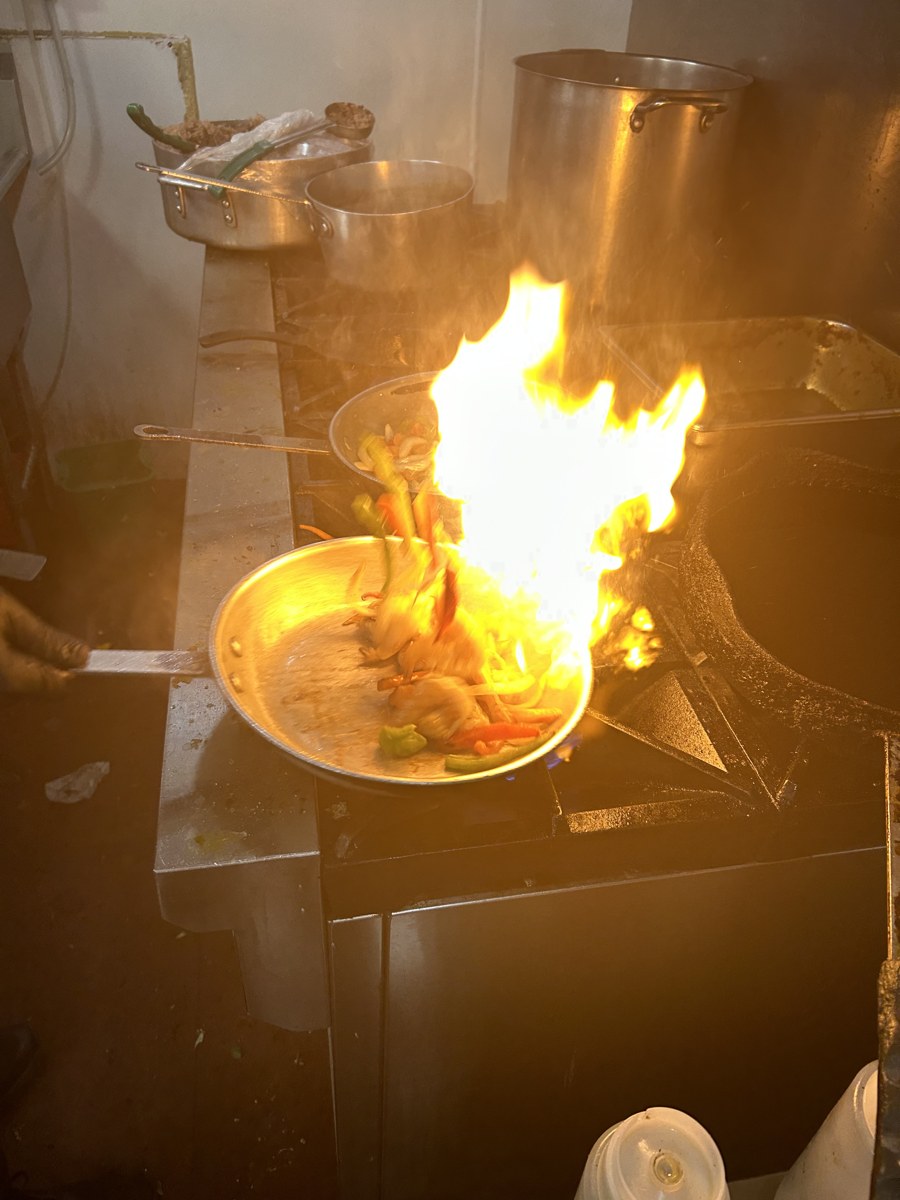 Dramatic kitchen flames during cooking